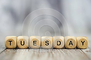 The word Tuesday on wooden cubes. Weekday concept