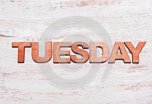 Word tuesday in wooden letters