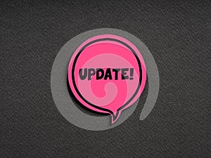 The word update on pink speech bubble on black background. Technology update or upgrade information announcement