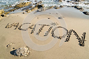 Word vacation on sandy sea coast