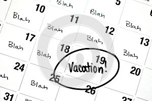 The Word Vacation is Written and Circled on a Calendar