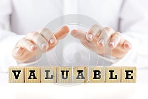 The word - Valuable- on wooden cubes