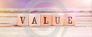 Word Value with wood cubes on table