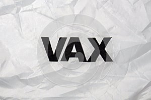 The word VAX on white crumpled background, top view, Vax declared The Oxford Word of The Year 2021