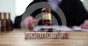 Word about violence judge knocks gavel in courtroom closeup