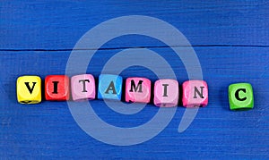 The word Vitamin C on a wood table