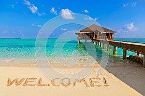 Word Welcome on beach