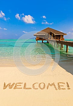 Word Welcome on beach