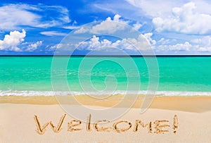 Word Welcome on beach