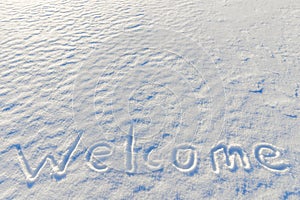 Word welcome written on the snow