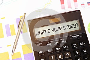 Word WHAT YOUR STORY on calculator. Business and tax concept