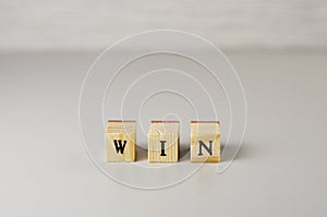 The word win made of letters on wooden cubes 3