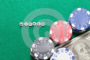 Word `winner` with poker chips and money