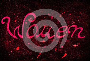 The word Woman in pink isolated on a black textured background. photo