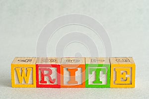 The word write spelled with colorful blocks