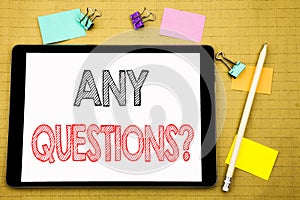 Word, writing Any Questions. Business concept for Answer Help Question Written on tablet laptop, wooden background with sticky not