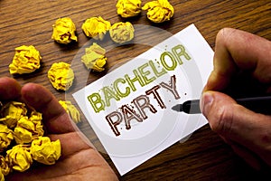 Word, writing Bachelor Party. Concept for Stag Fun Celebrate written on notebook note paper on the wooden background with folded p photo