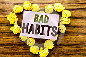 Word, writing Bad Habits. Business concept for Improvement Break Habitual Hebit written on sticky note paper on the wooden backgro