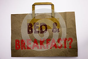 Word, writing Bed Breakfast. Business concept for Holiday Journey Travel Written on shopping bag, white isolated background.