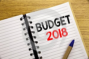 Word, writing Budget 2018. Business concept for Household budgeting accounting planning written on notepad with copy space on old
