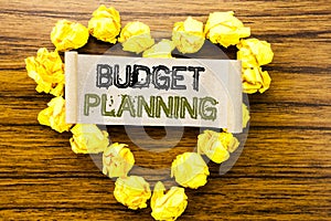 Word, writing Budget Planning. Business concept for Financial Budgeting written on sticky note paper on the dark wooden background