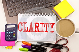 Word writing Clarity in the office with laptop, marker, pen, stationery, coffee. Business concept for Clarity Message Workshop wh