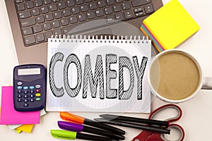 Word writing Comedy in the office with laptop, marker, pen, stationery, coffee. Business concept for Stand Up Comedy Microphone Wo