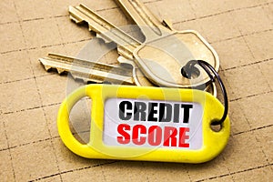 Word, writing Credit Score. Business concept for Financial Rating Record Written on key holder, textured background close up.