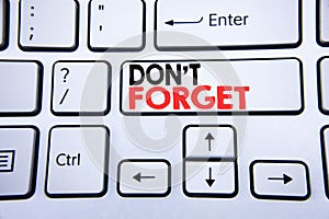 Word, writing Do Not Forget. Business concept for Don t memory Remider written on white keyboard key with copy space. Top view. photo