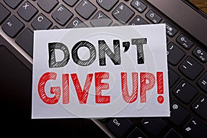 Word, writing Don t Give Up. Business concept for Motivation Determination, written on sticky note paper on the dark keyboard back