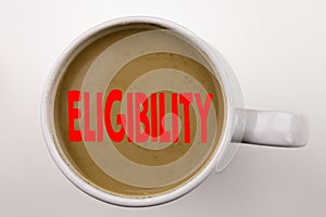 Word, writing Eligibility text in coffee in cup. Business concept for Suitable Eligible Eligibility on white background with copy