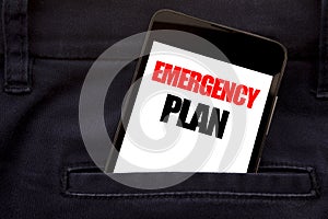 Word, writing Emergency Plan. Business concept for Disaster Protection Written phone mobile phone, cellphone placed in the man fro