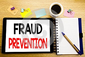 Word, writing Fraud Prevention. Business concept for Crime Protection Written on tablet laptop, wooden background with sticky note