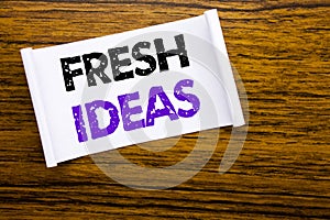 Word, writing Fresh Ideas. Business concept for Thinking Inspiration Inspire Creativity written on sticky note paper on the wooden