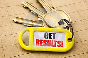 Word, writing Get Results. Business concept for Achieve Result Written on key holder, textured background close up.