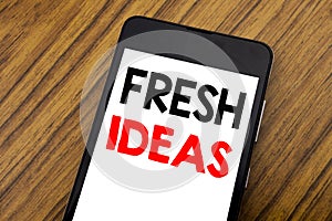 Word, writing handwriting Fresh Ideas. Business concept for Thinking Inspiration Inspire Creativity Written on mobile phone cellph