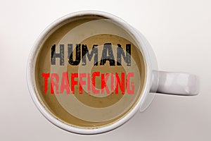 Word, writing Human Trafficking text in coffee in cup Business concept for Slavery Crime Prevention on white background with copy