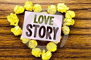 Word, writing Love Story. Business concept for Loving Someone Heart written on sticky note paper on the wooden background.