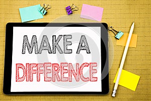 Word, writing Make A Difference. Business concept for Motivation Success Written on tablet laptop, wooden background with sticky n