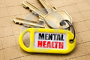 Word, writing Mental Health. Business concept for Anxiety Illness Disorder Written on key holder, textured background close up.