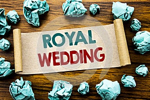 Word, writing Royal Wedding. Business concept for British England Wedding Written on sticky note paper, wooden background with fol