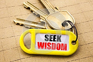 Word, writing Seek Wisdom. Business concept for Inspiration Knowledge Written on key holder, textured background close up.