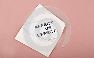 Word Writing Text Affect vs Effect on card on the pink background