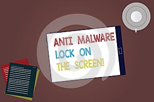 Word writing text Anti Malware Lock On The Screen. Business concept for Security safety against malware hacking Tablet Empty