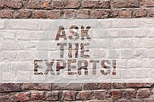 Word writing text Ask The Experts. Business concept for Look for a professional advice consultation support Brick Wall