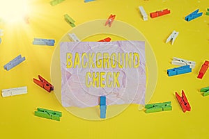 Word writing text Background Check. Business concept for way to discover issues that could affect your business Colored clothespin