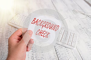 Word writing text Background Check. Business concept for way to discover issues that could affect your business man holding