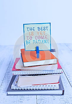 Word writing text The Best Is Yet To Come Be Patient. Business concept for dont lose hope light come after darkness pile