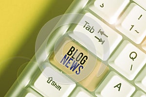 Word writing text Blog News. Business concept for regularly updated website typically one run by an individual White pc