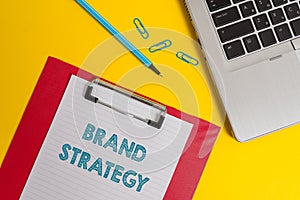 Word writing text Brand Strategy. Business concept for Long term marketing support for a product Marketing Open laptop